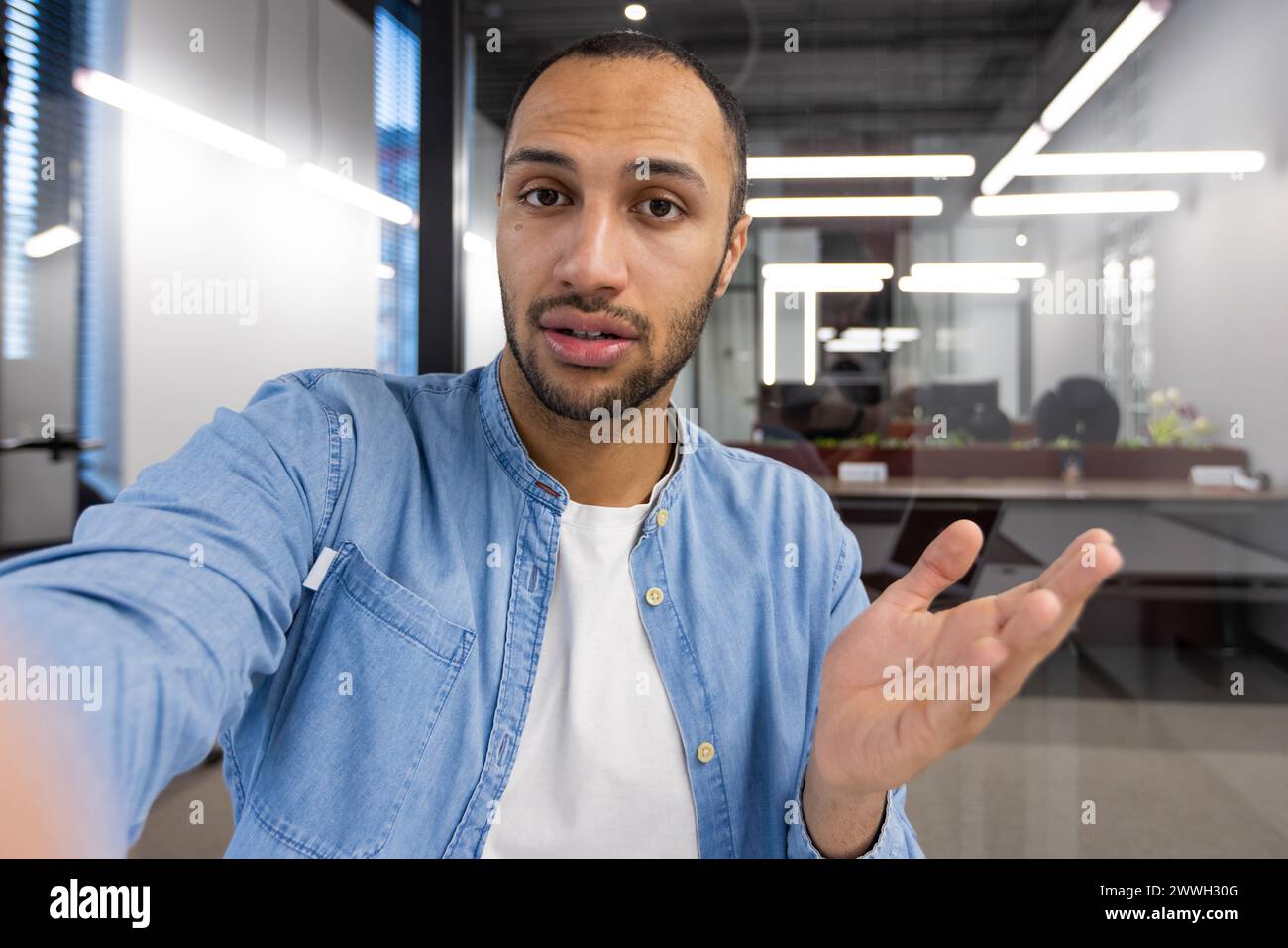 Man in blue shirt wearing hi-res stock photography and images - Alamy