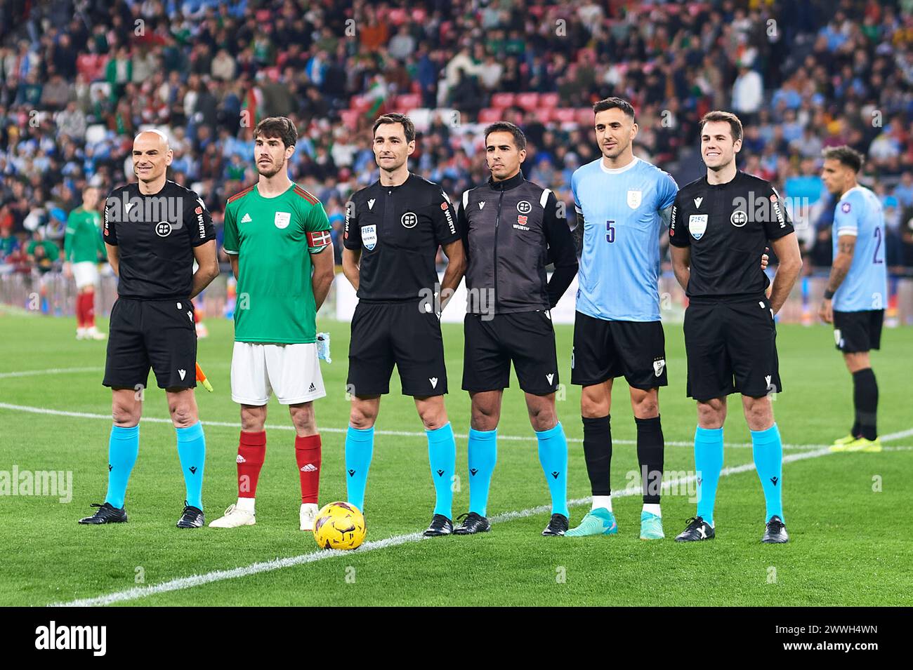 Bilbao, Spain. 23 March, 2024. Referee Ricardo de Burgos Bengoetxea, Aritz Elustondo of Pais Vasco and Matias Vecino of Uruguay looks on during the Friendly Match Pais Vasco v Uruguay at Estadio de San Mames on March 23, 2024 in Bilbao, Spain. Credit: Cesar Ortiz Gonzalez/Alamy Live News Stock Photo