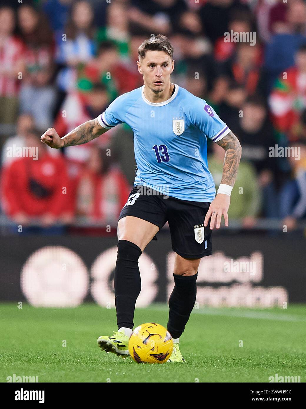 Bilbao, Spain. 23 March, 2024. Guillermo Varela of Uruguay with the ball during the Friendly Match Pais Vasco v Uruguay at Estadio de San Mames on March 23, 2024 in Bilbao, Spain. Credit: Cesar Ortiz Gonzalez/Alamy Live News Stock Photo