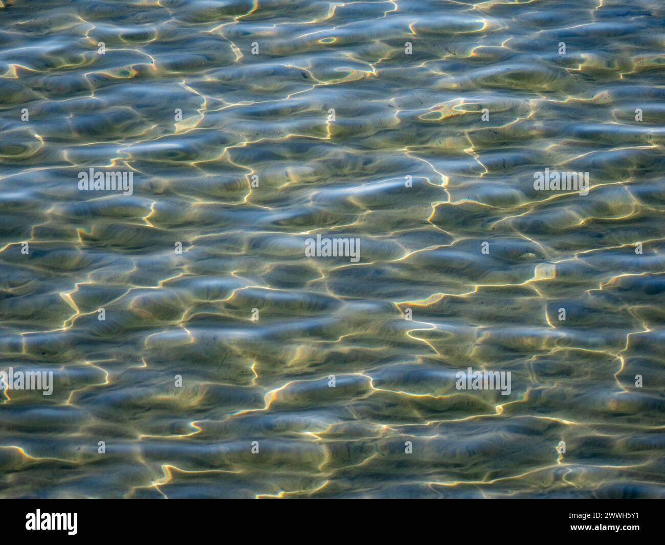 Water surface in the bay of Ogliastro Marina in Italy. Good to use as a ...