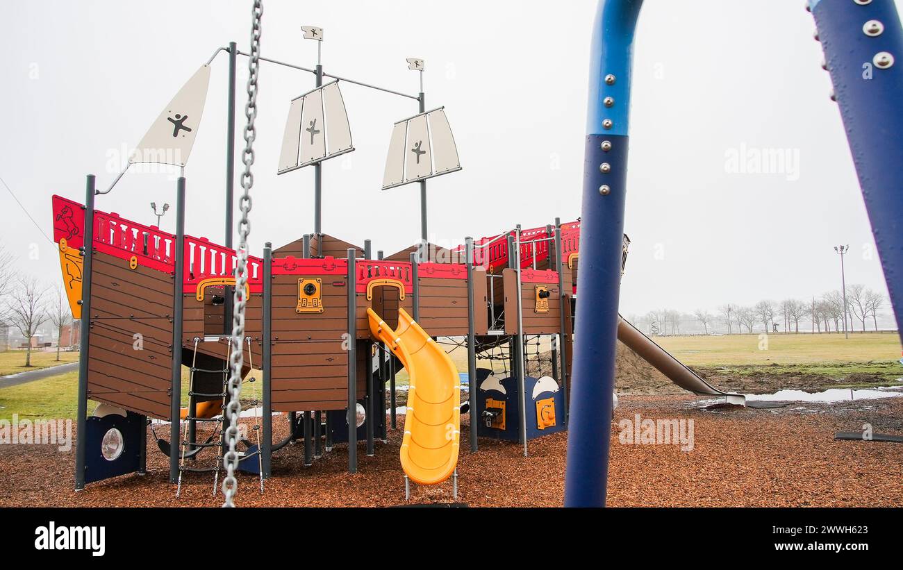NORWALK,CT, USA - MARCH 6, 2024: Empty playground in Veterans Park in winter foggy  day Stock Photo
