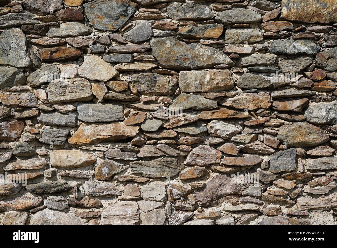 Frontal view of an old stone wall of a castle Stock Photo
