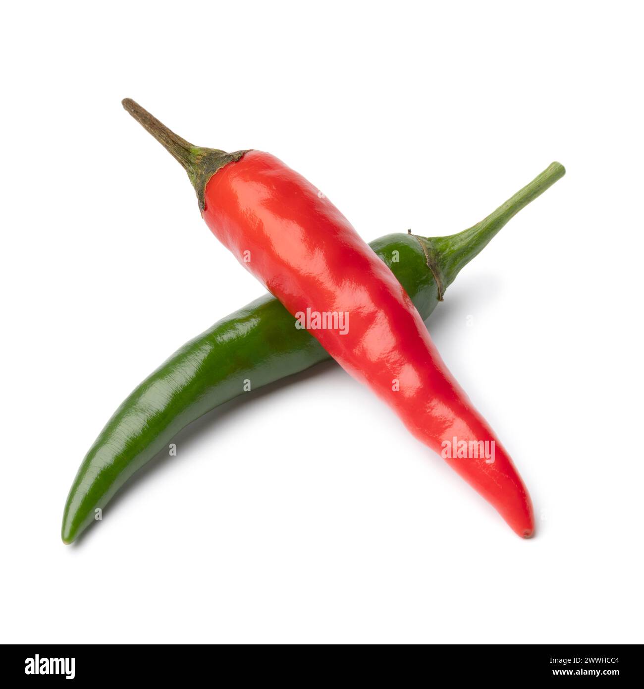 Whole fresh raw green and red rawit pepper close up isolated on white background Stock Photo