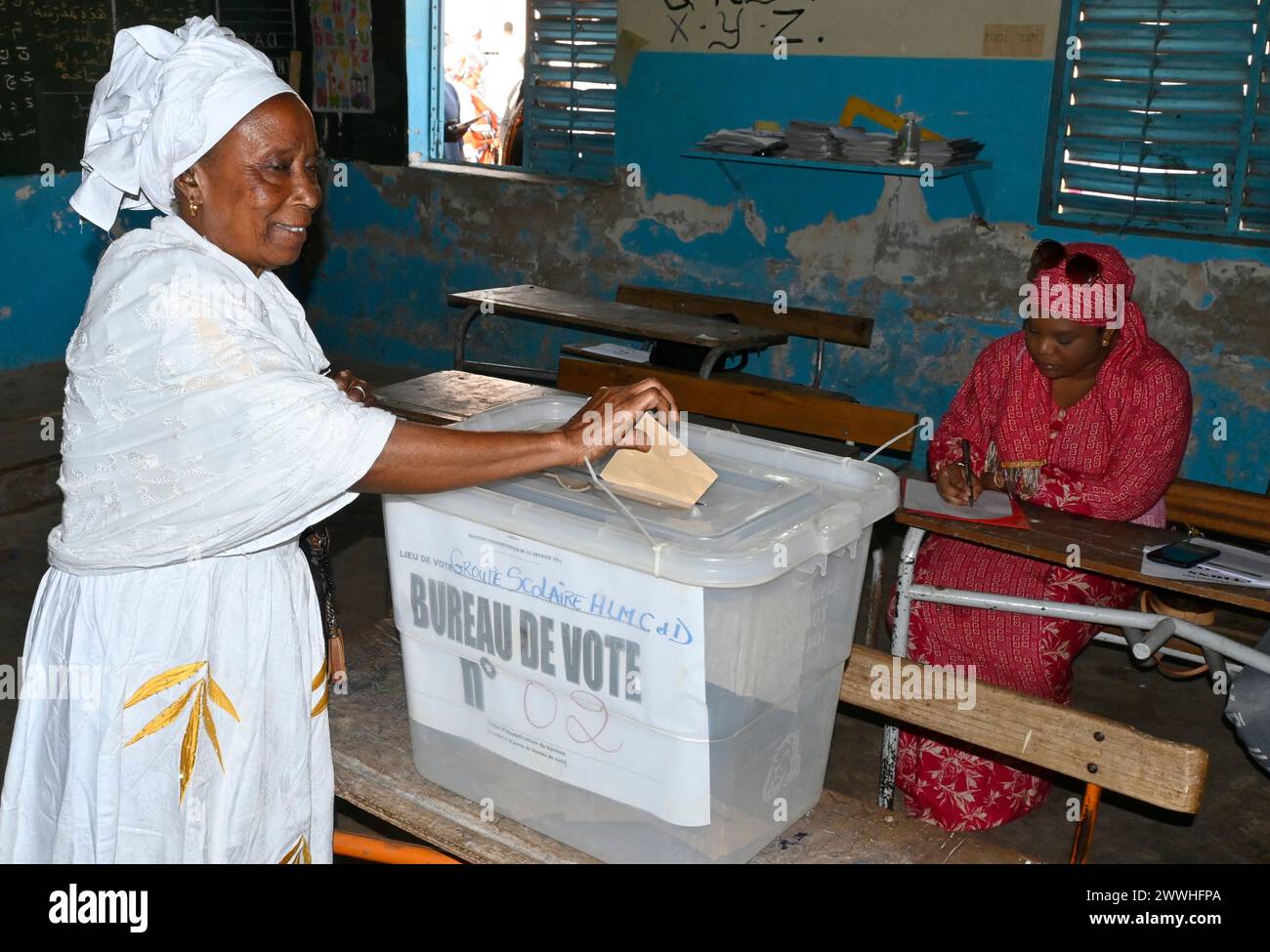 Dakar, Senegal. 24th Mar, 2024. A voter casts the ballot in Dakar, Senegal, March 24, 2024. The first round of the Senegalese presidential election started on Sunday at 8 a.m. local time. Credit: Demba Gueye/Xinhua/Alamy Live News Stock Photo