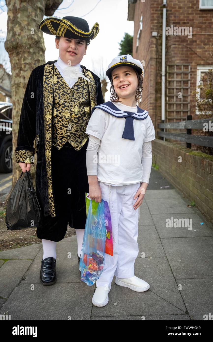 London, UK.  24 March 2024.  Children in Stamford Hill, north London, dress in colourful costumes as they celebrate the Jewish festival of Purim. The festival involves the reading of the Book of Esther, describing the defeat of Haman, the Persian king's adviser, who plotted to massacre the Jewish people 2,500 years ago, but the event was prevented by Esther’s courage. (PARENTAL PERMISSION GIVEN] Credit: Stephen Chung / Alamy Live News Stock Photo
