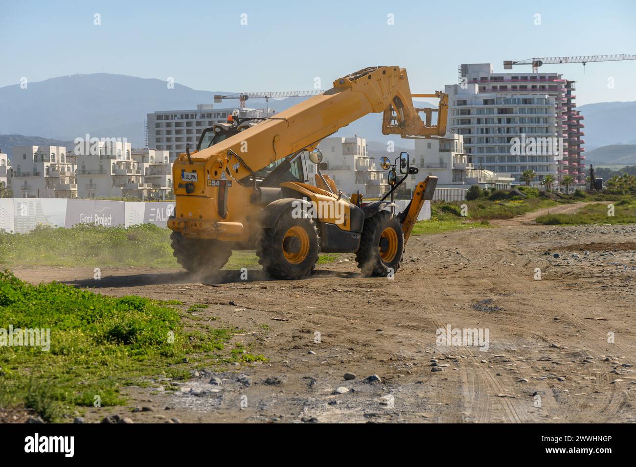 Gaziveren Cyprus 04/03/2024 - front loader rides on a construction site 1 Stock Photo
