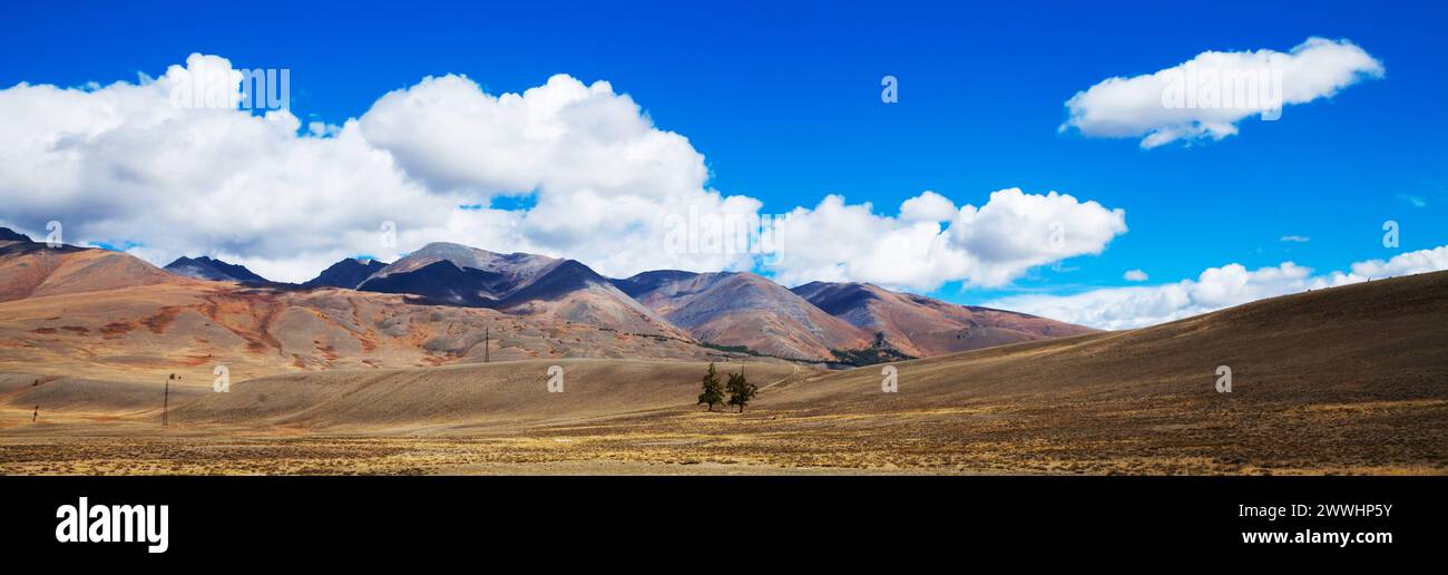 Prairie landscape with mountains panorama Beautiful steppe prairie landscape with mountains and blue sky with clouds panorama Copyright: xZoonar.com/T Stock Photo