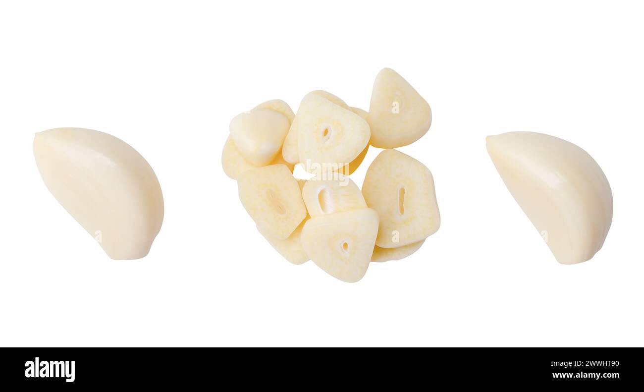 Top view set of peeled white garlic cloves with slices in stack is ...