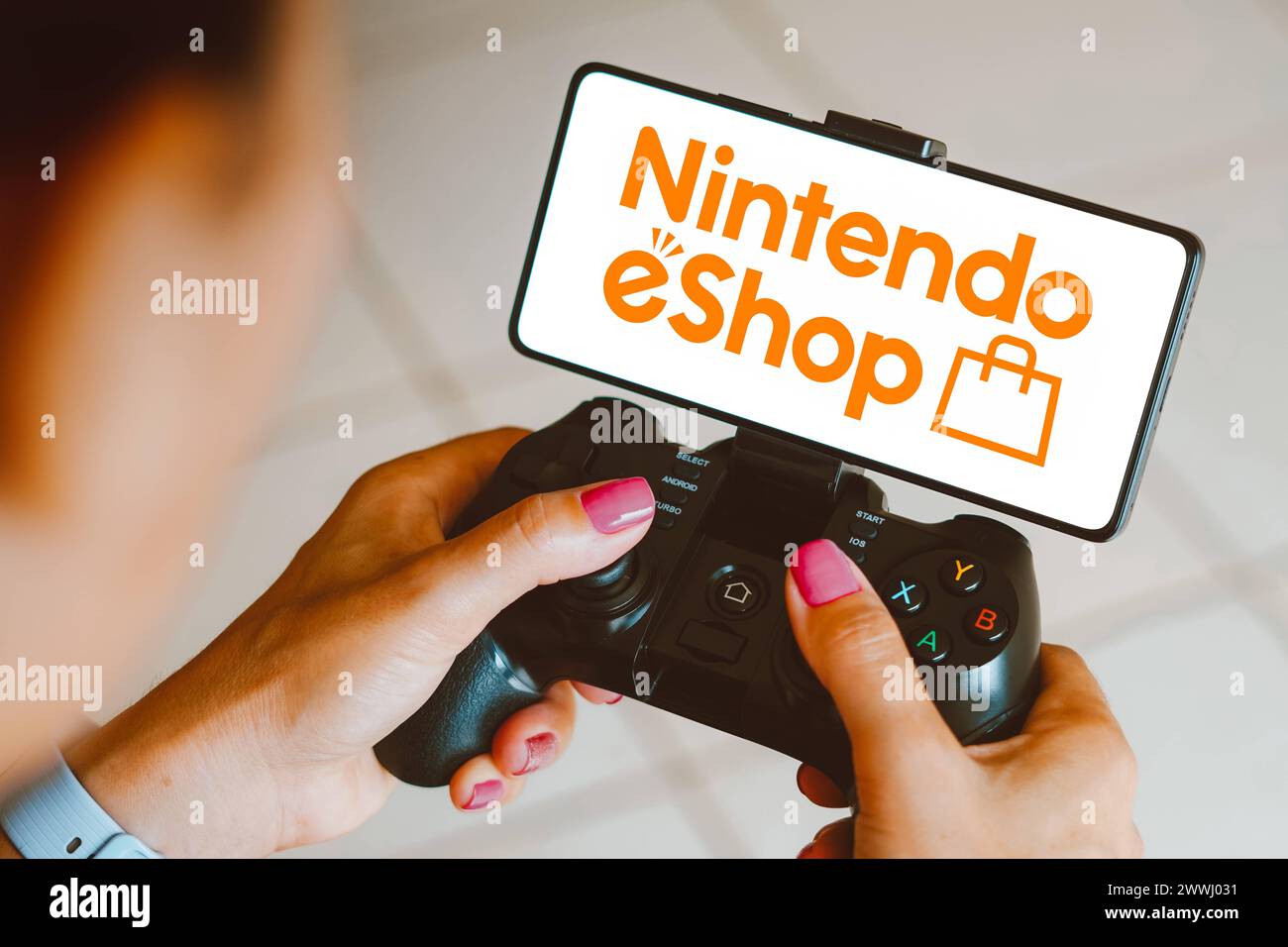 December 4, 2023, Brazil. In this photo illustration, the Nintendo eShop logo is displayed on a smartphone screen as a p December 4, 2023, Brazil. In Stock Photo