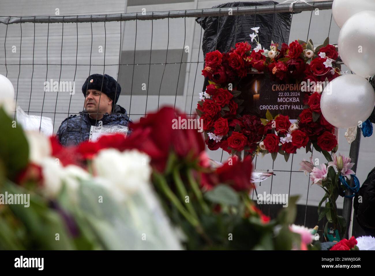 Moscow region, Russia. 24th of March, 2024. People lay flowers at a makeshift memorial in front of the Crocus City Hall in Krasnogorsk city, Moscow region, Russia. Credit: Nikolay Vinokurov/Alamy Live News Stock Photo