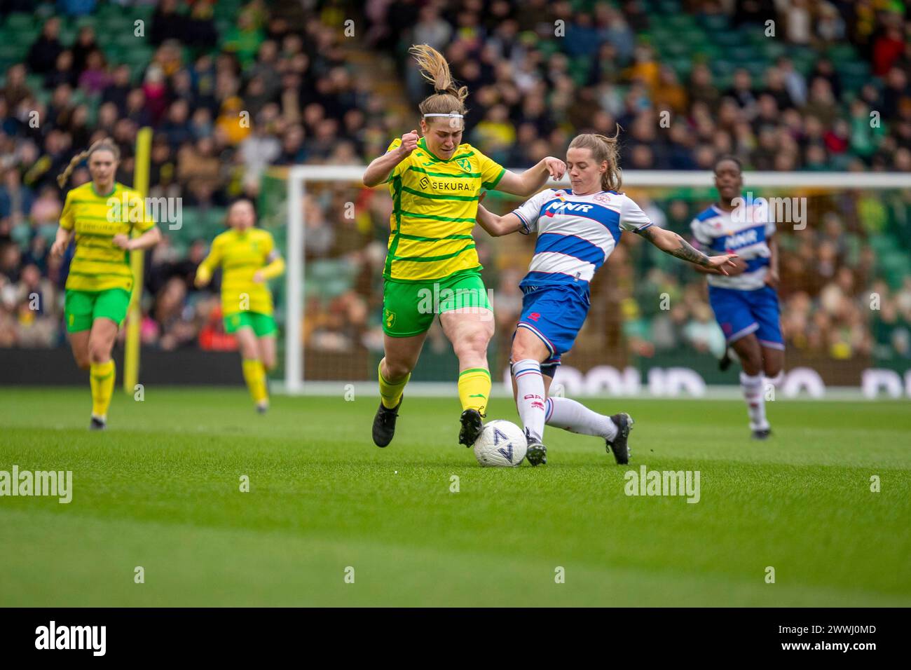 Norwich on Sunday 24th March 2024. Ceri Flye of Norwich City is tacked by Jo Blodgett of Queens Park Rangers during the FA Women's National League Division One match between Norwich City Women and Queens Park Rangers at Carrow Road, Norwich on Sunday 24th March 2024. (Photo: David Watts | MI News) Credit: MI News & Sport /Alamy Live News Stock Photo