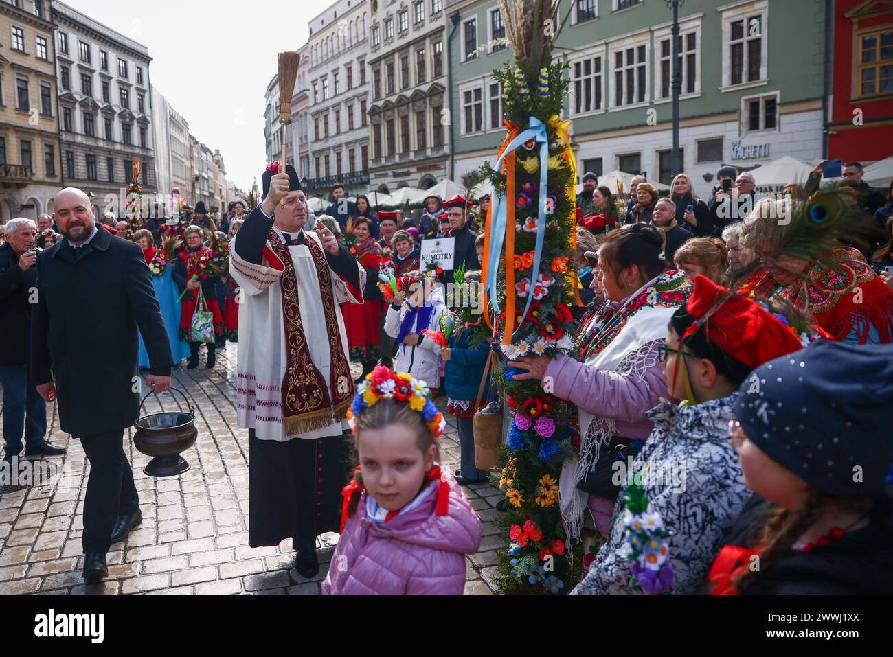 Krakow, Poland. 24th Mar, 2024. People attend traditional Palm Sunday celebration at the Main Square in Krakow, Poland on March 24, 2024. During Palm Sunday, which is also called The Sunday of the Lord's Passion, participants attend a Holy Mass and walk in the procession carrying handwoven palms made from a variety of flowers and plants. (Credit Image: © Beata Zawrzel/ZUMA Press Wire) EDITORIAL USAGE ONLY! Not for Commercial USAGE! Credit: ZUMA Press, Inc./Alamy Live News Stock Photo