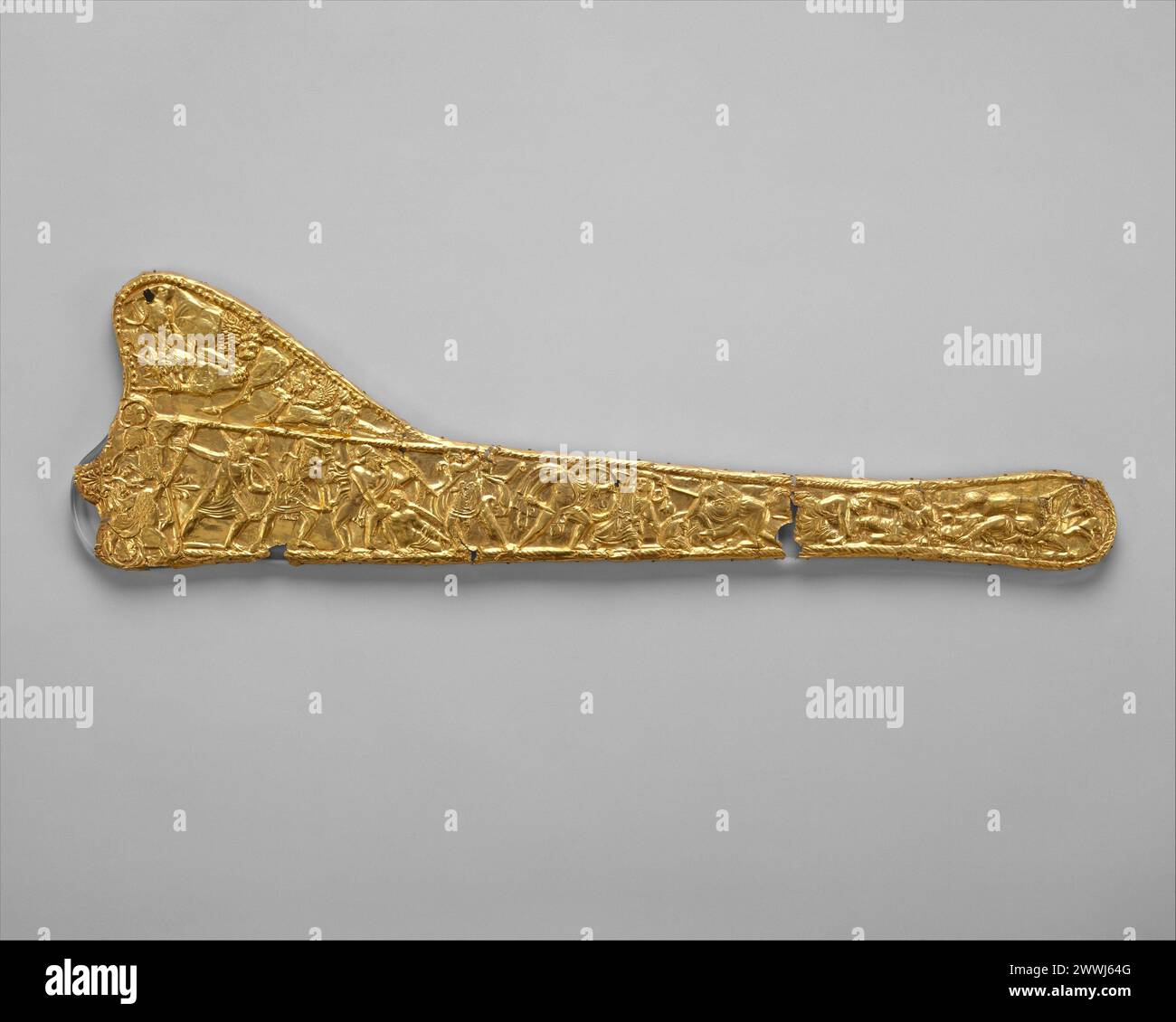 Sheet-gold decoration for a sword scabbard, Late Classical or Hellenistic, ca. 340–320 B.C., Greek or Scythian, Gold, length 21 7/16 in. (54.5 cm), Gold and Silver, In the main frieze is a battle between Greeks and barbarians; at the left end stand two griffins. ca. 340–320 BCE Stock Photo