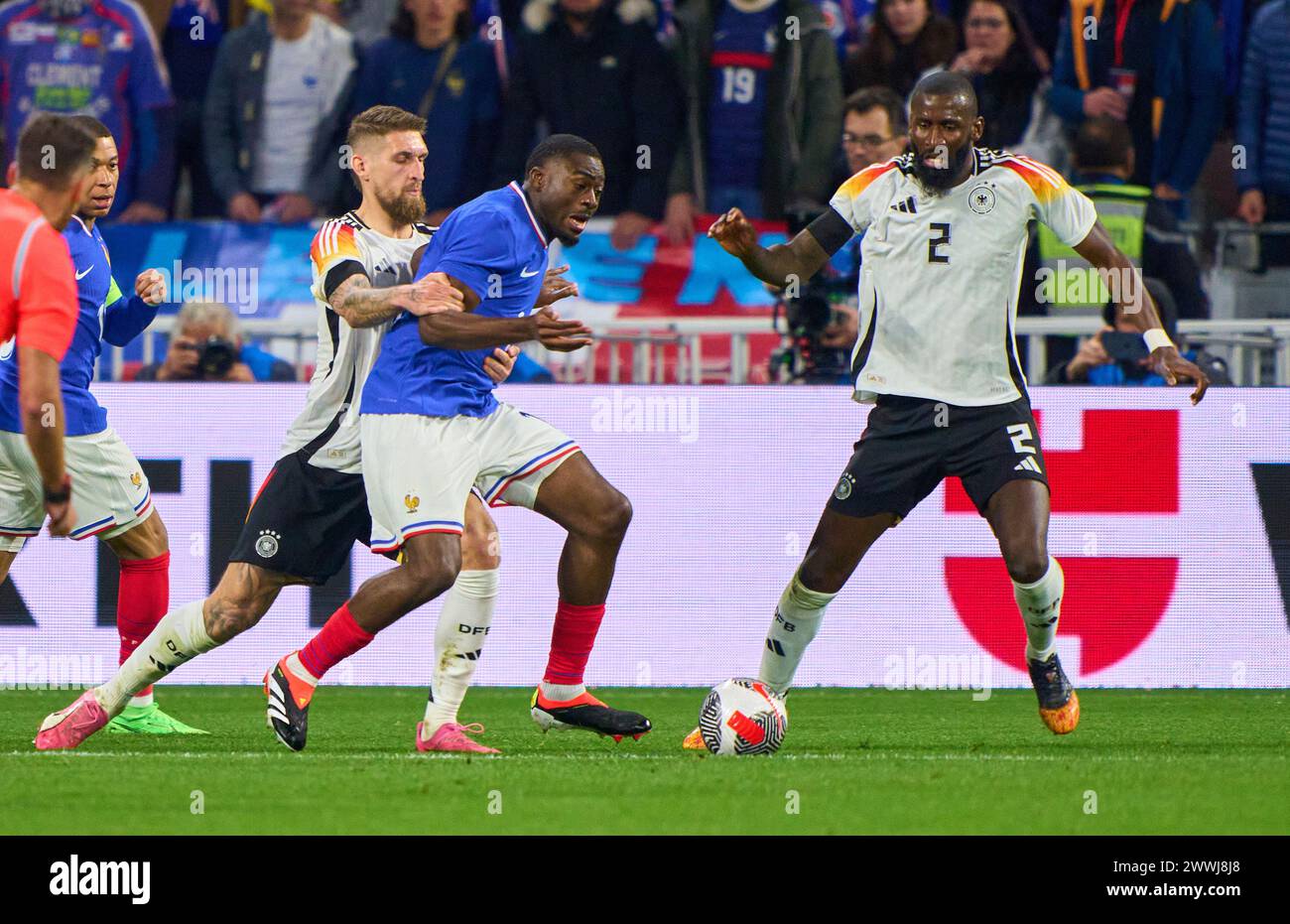 Robert Andrich, DFB 23  Antonio Rüdiger, Ruediger, DFB 2 compete for the ball, tackling, duel, header, zweikampf, action, fight against Youssouf Fofana, FRA 19  in the friendly match FRANCE - GERMANY  0-2  FRANKREICH - DEUTSCHLAND 0-2 in preparation for European Championships 2024  on Mar 23, 2024  in Lyon, France.  © Peter Schatz / Alamy Live News Stock Photo