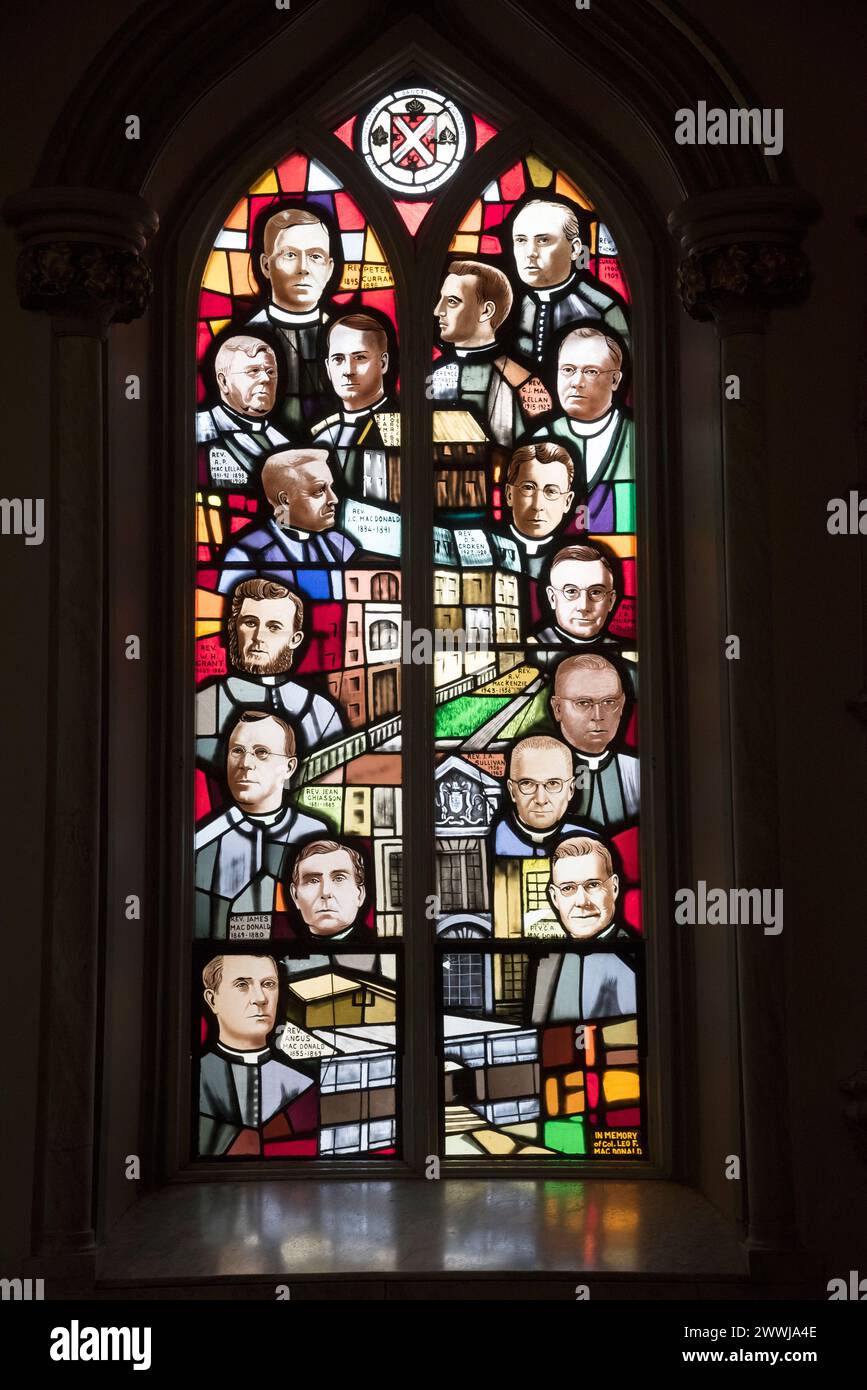 Stained glass window depicting historical figures at St Dustans Basilica,  Charlottetown, Prince Edward Island, Canada. Stock Photo