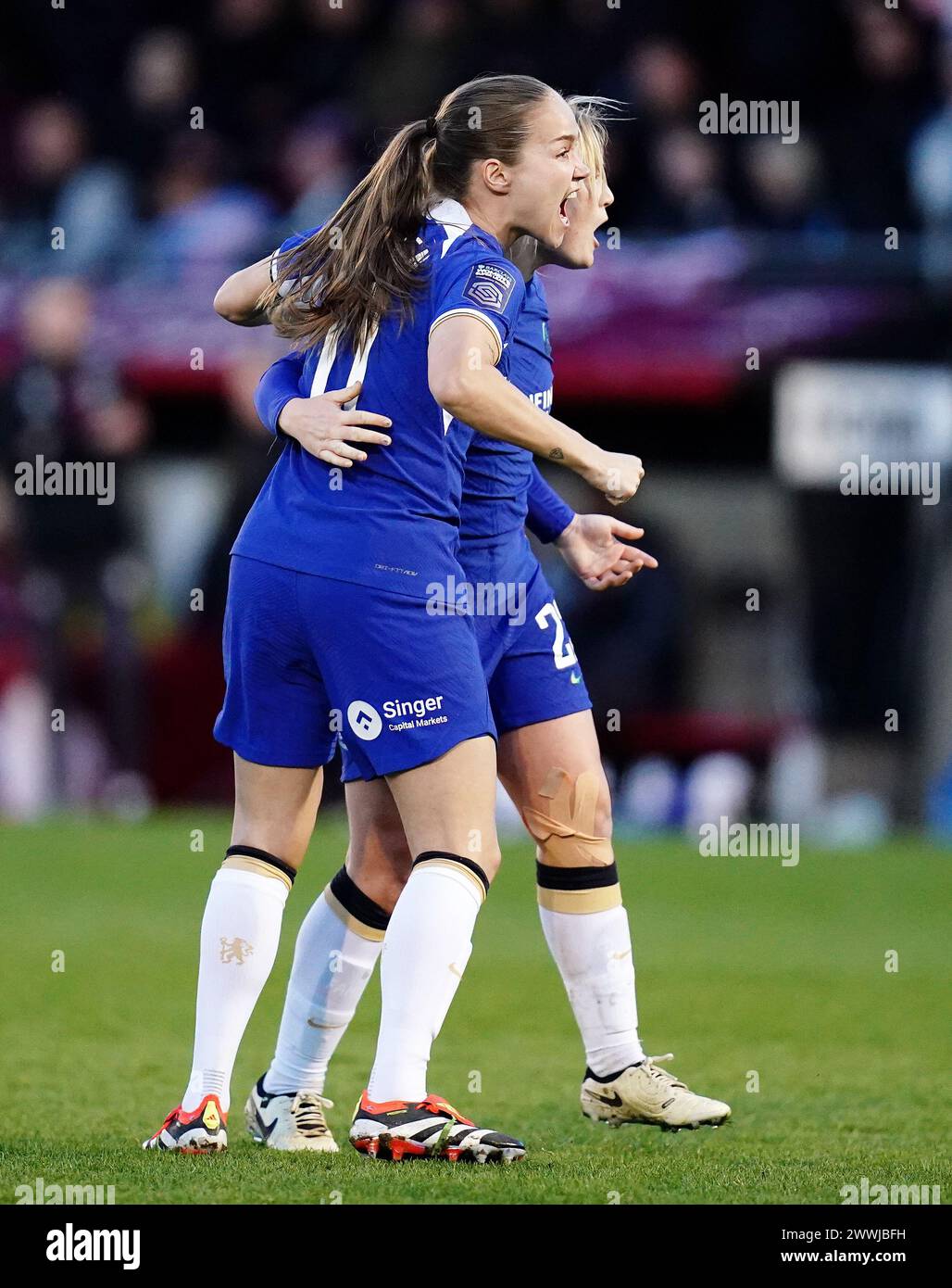Erin cuthbert (partially hidden) celebrates scoring their side's second