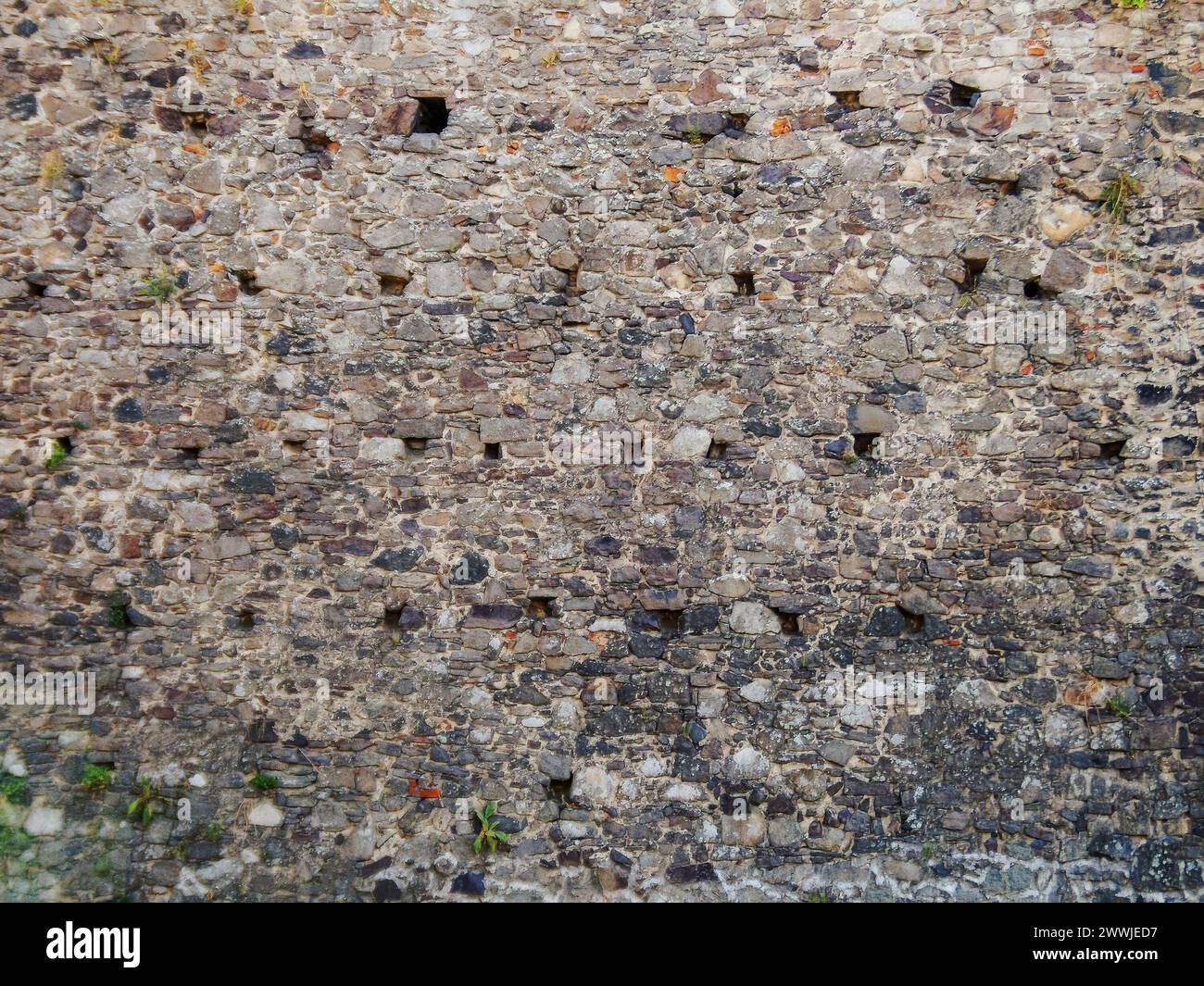 medieval stone masonry of castle wall. grunge architectural background Stock Photo