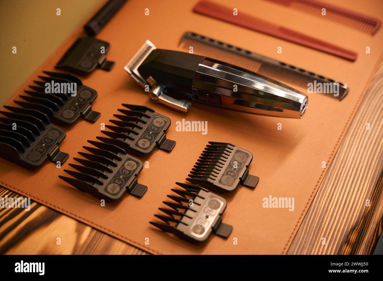 Electric hair clipper with clean razor blades on table Stock Photo