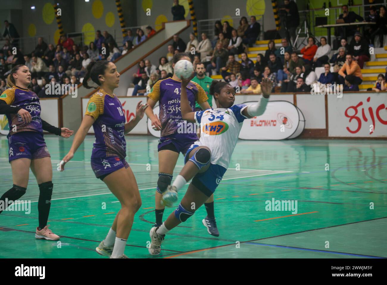 Gijón, Spain, March 23, 2024: The KH-7 BM. Granollers player, Kadidiatou Jallow (34) shoots on goal against several rivals during the 22nd Matchday of the Guerreras Iberdrola League 2023-24 between Motive.co Gijón Balonmano La Calzada and KH-7 BM. Granollers, on March 23, 2024, at the La Arena Pavilion, in Gijón, Spain. (Photo by Alberto Brevers/Pacific Press/Sipa USA) Credit: Sipa USA/Alamy Live News Stock Photo