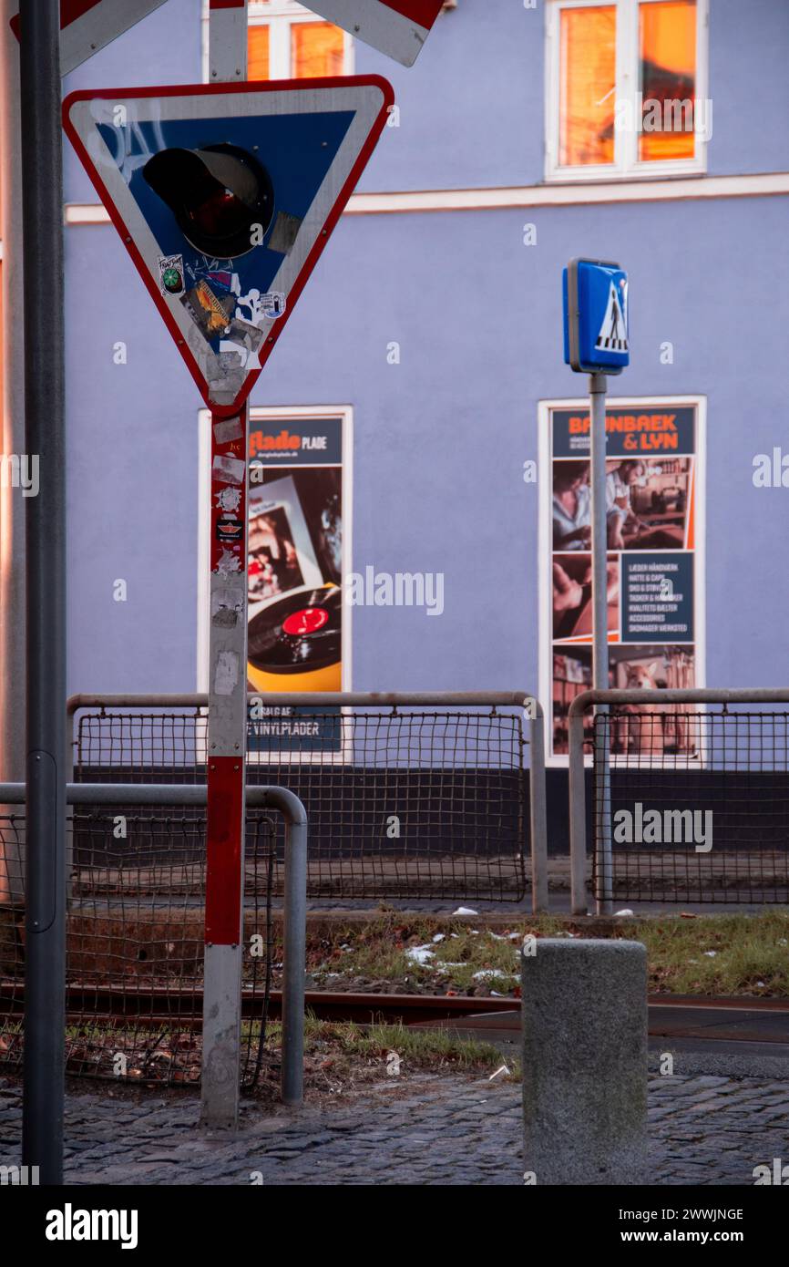 Train crossing with grafitti and advertisements Stock Photo