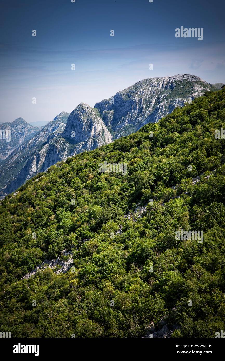 The mountains around the Bay of Kotor rise quickly in Montenegro. Stock Photo