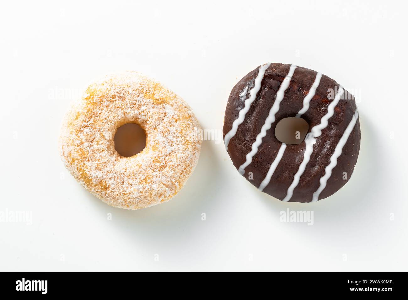 Sweet donuts with chocolate glaze and sugar on white Stock Photo