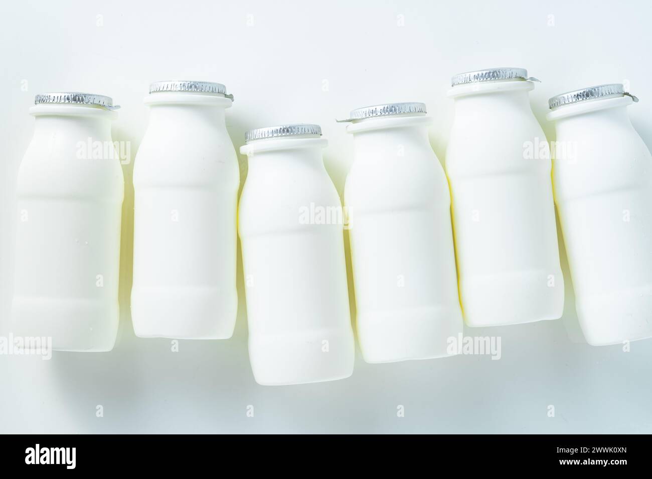 drinking yogurt with probiotic in bottles on white Stock Photo