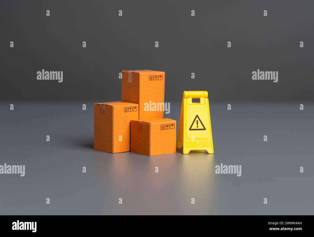 Boxes and warning sign. Restrictions on trade, import and export of goods. Doubts about product quality. Smuggling and the gray market. Trade restrict Stock Photo