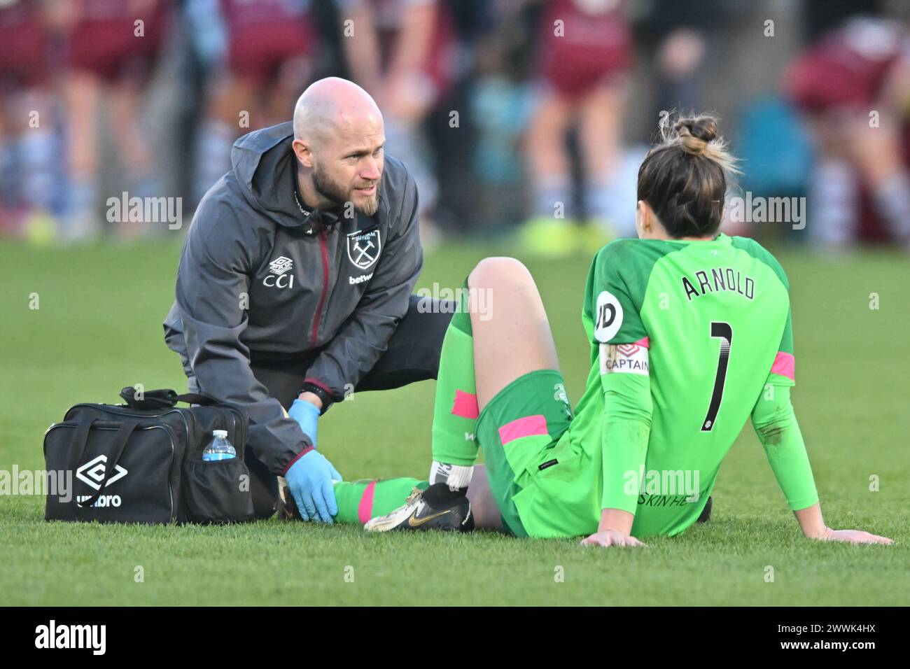Dagenham on Sunday 24th March 2024. Goalkeeper Mackenzie Arnold (1 West Ham) receives medical treatment during the Barclays FA Women's Super League match between West Ham United and Chelsea at the Chigwell Construction Stadium, Dagenham on Sunday 24th March 2024. (Photo: Kevin Hodgson | MI News) Credit: MI News & Sport /Alamy Live News Stock Photo