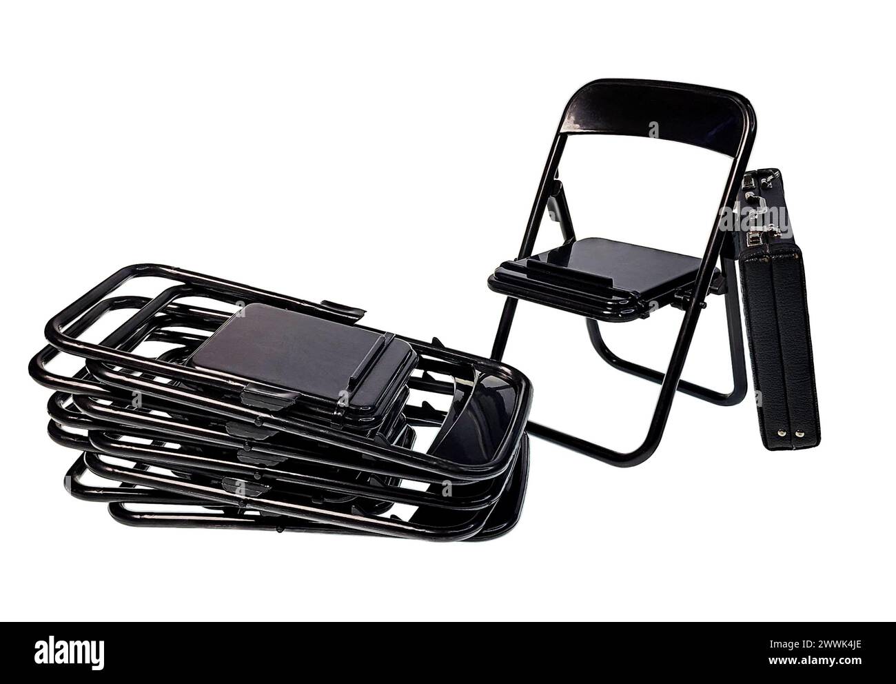 A set of Black Folding chairs for easy seating for groups and briefcase Stock Photo