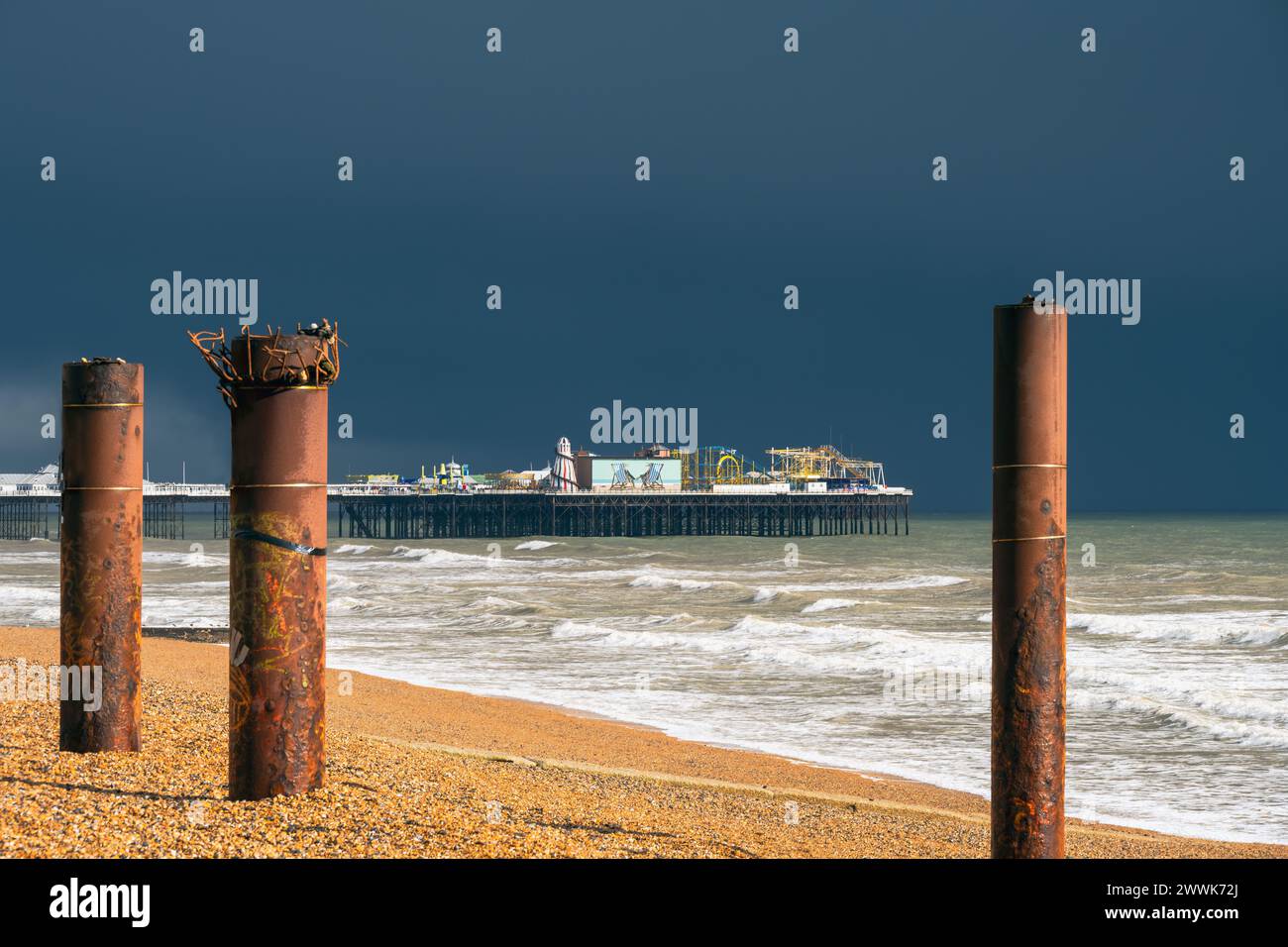 View of Brighton Palace Pier from the beach just before the rain, South East England Stock Photo