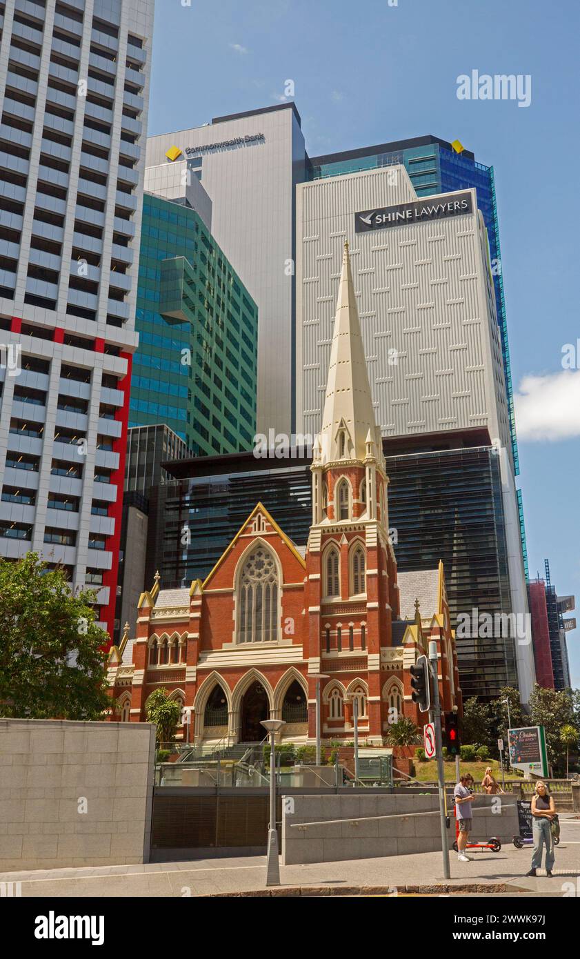 Elegant 19th century Albert Street Uniting Church dwarfed by modern buildings in CBD of Brisbane Australia Stock Photo