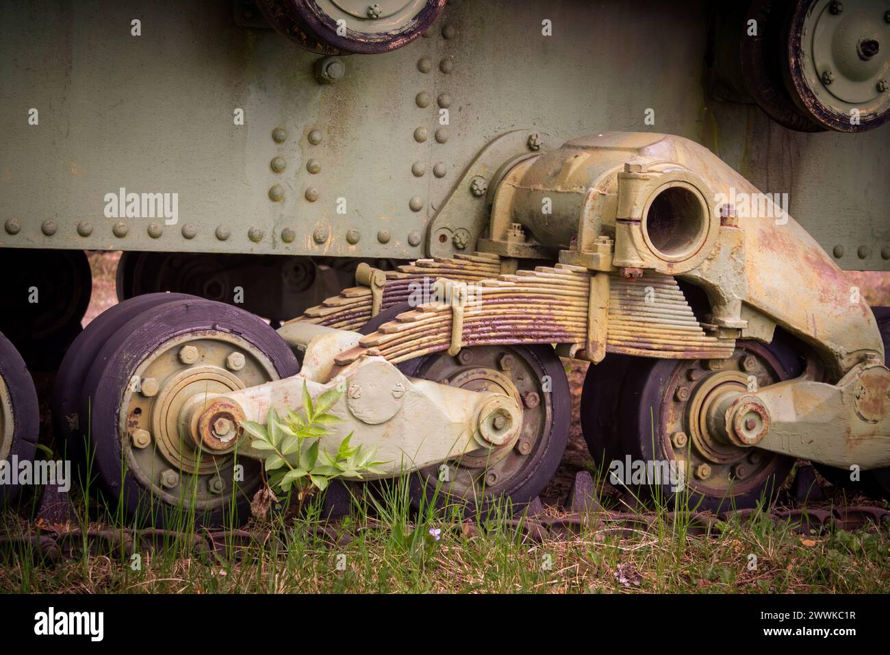 Closeup of wheels, suspension and caterpillar track of an old tank Stock Photo