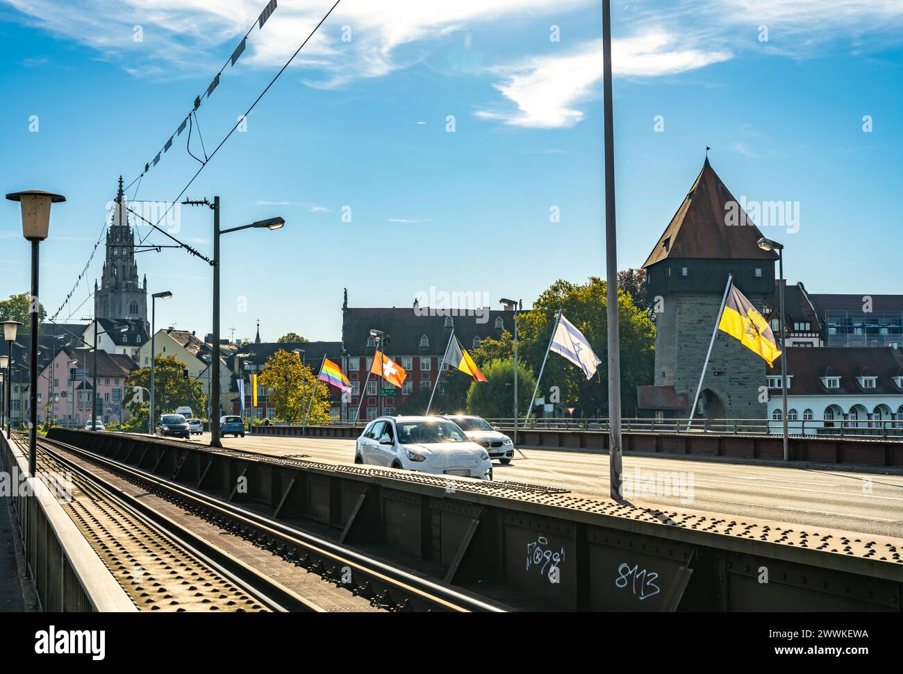 Description: Car traffic on the bridge on a sunny day with the Rheintorturm and the Münster in the background. Rhine bridge, Konstanz, Lake Constance Stock Photo
