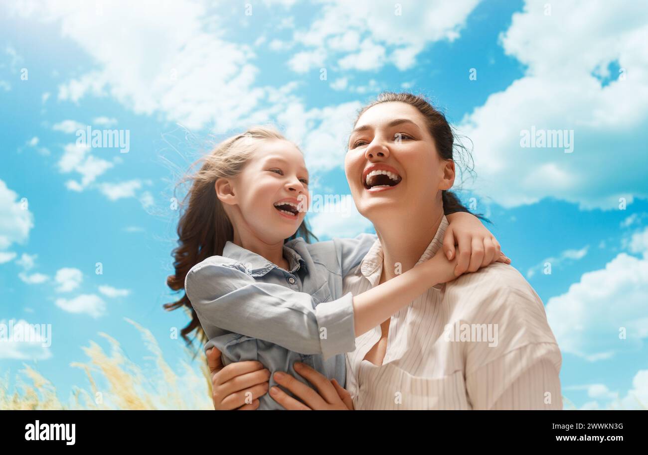 Happy family at nature. Mother and child are having fun and enjoying summer days. Stock Photo