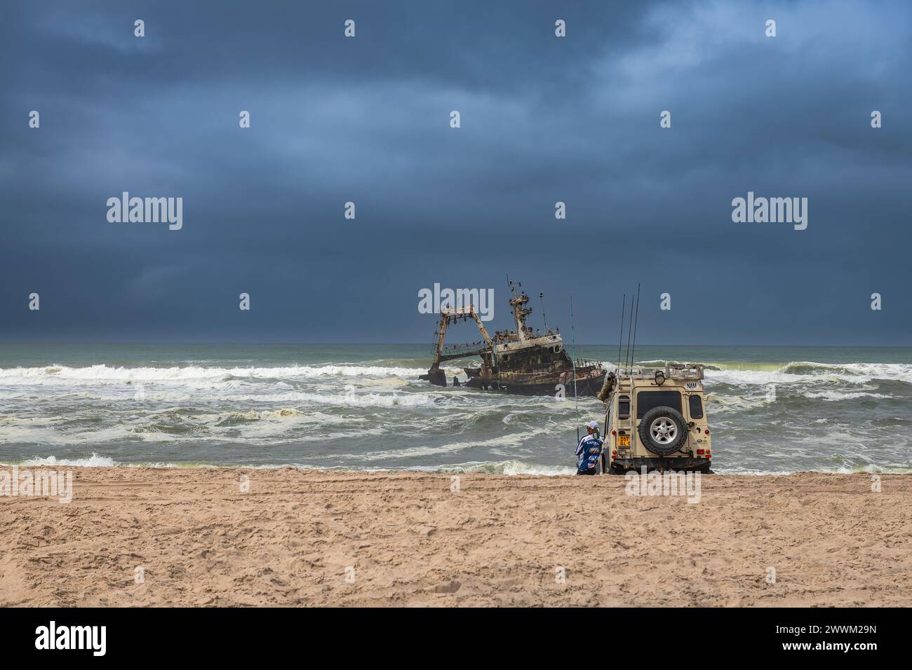 Deep sea fishermen at the wreck of the fishing vessel Zeila, Skeleton Coast, Namibia Stock Photo