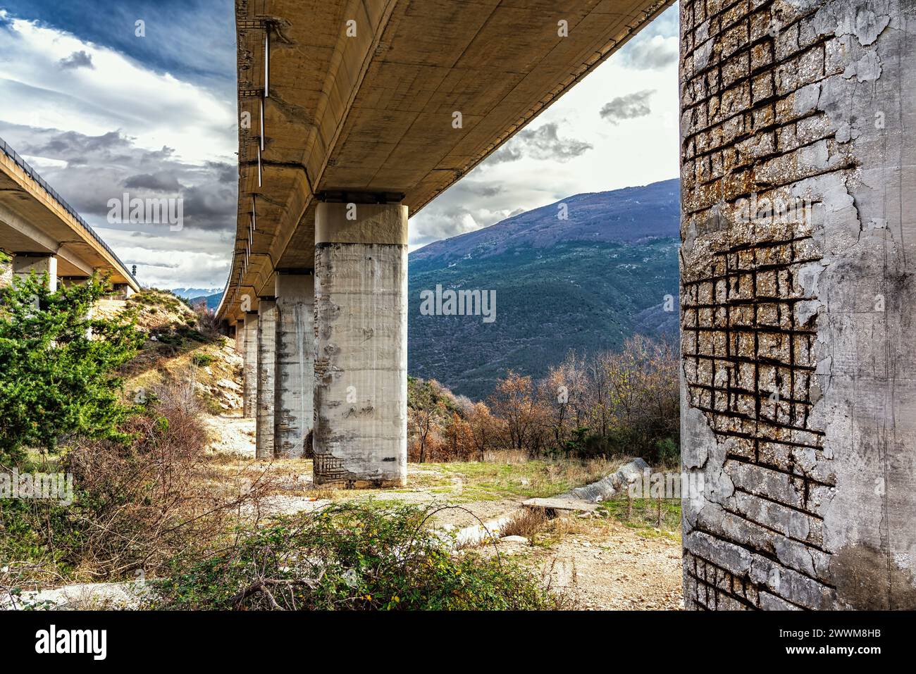Deteriorated and worn highway pylons with exposed and rusted iron. Abruzzo, Italy, Europe Stock Photo