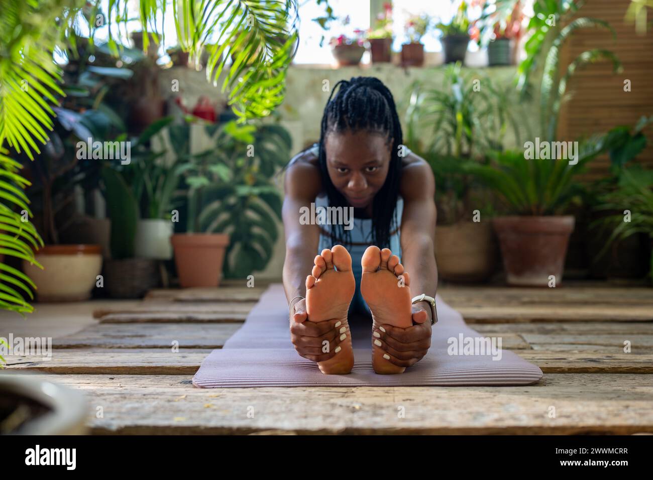 Athletic african american woman do flexibility exercise warm up muscles ...
