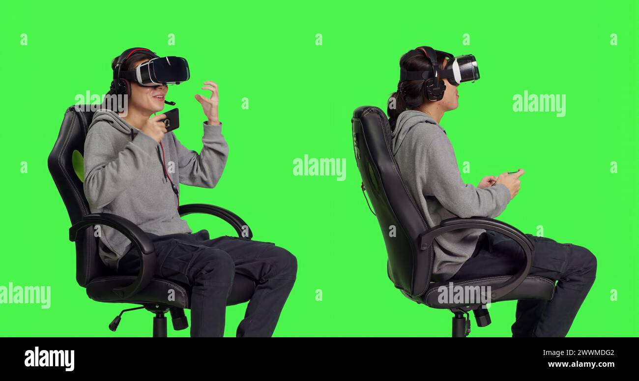 Asian guy plays mobile game with vr headset in studio, enjoying online
