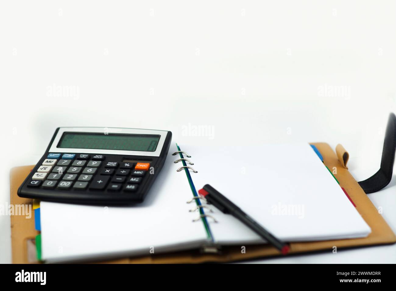 Financial notebook and pen isolated on a white background Stock Photo