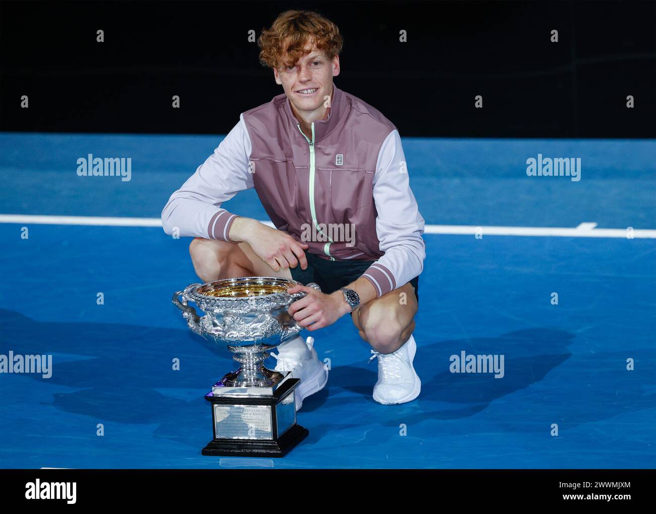 Grand Slam winner Jannik Sinner (ITA) posing with the trophy at the