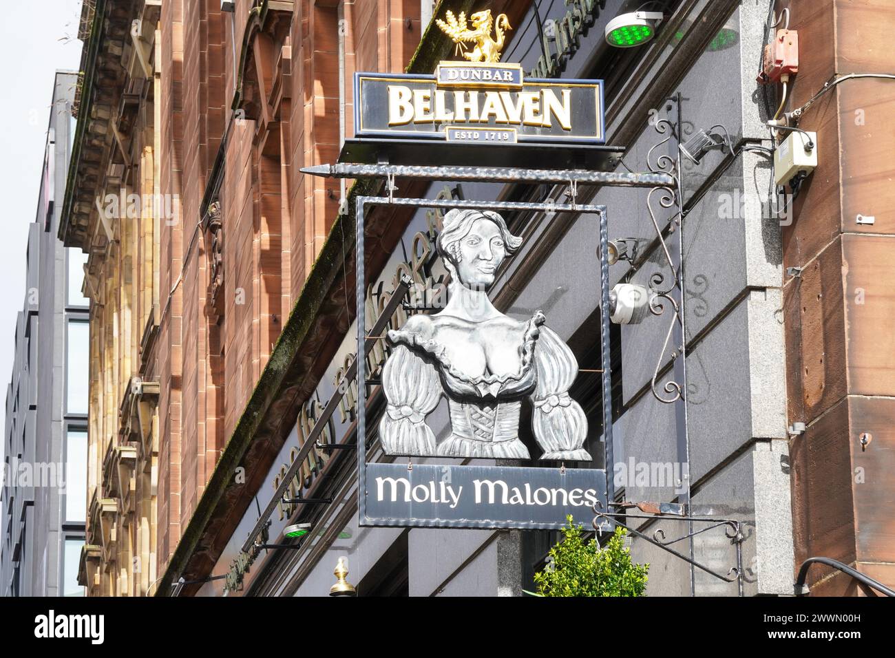 Metal pub sign hanging outside the Molly Malone Irish themed pub in
