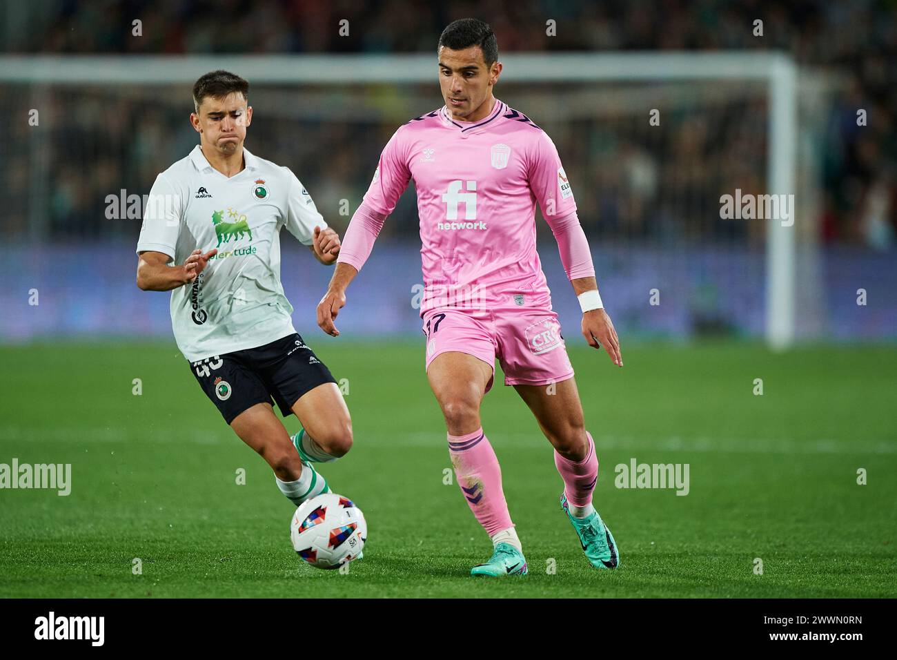 Jesus Clemente of CD Eldense compete for the ball with Mario Garcia of