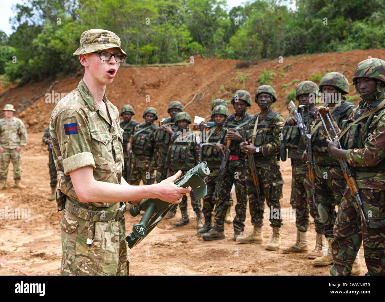 British army Drummer Todd Yates, assigned to 1st Battalion Irish Guards, 11th Security Force Assistance Brigade, British Army, demonstrates how to assemble a mine detector to Kenya Defence Forces during counter improvised explosive devices training at Justified Accord 2024 (JA24) held at the Counter Insurgency Terrorism and Stability Training Centre, Nanyuki, Kenya, February 26, 2024. JA24 is U.S. Africa Command's largest exercise in East Africa, running from February 26 - March 7. Led by U.S. Army Southern European Task Force, Africa (SETAF-AF), and hosted in Kenya, this year's exercise will Stock Photo