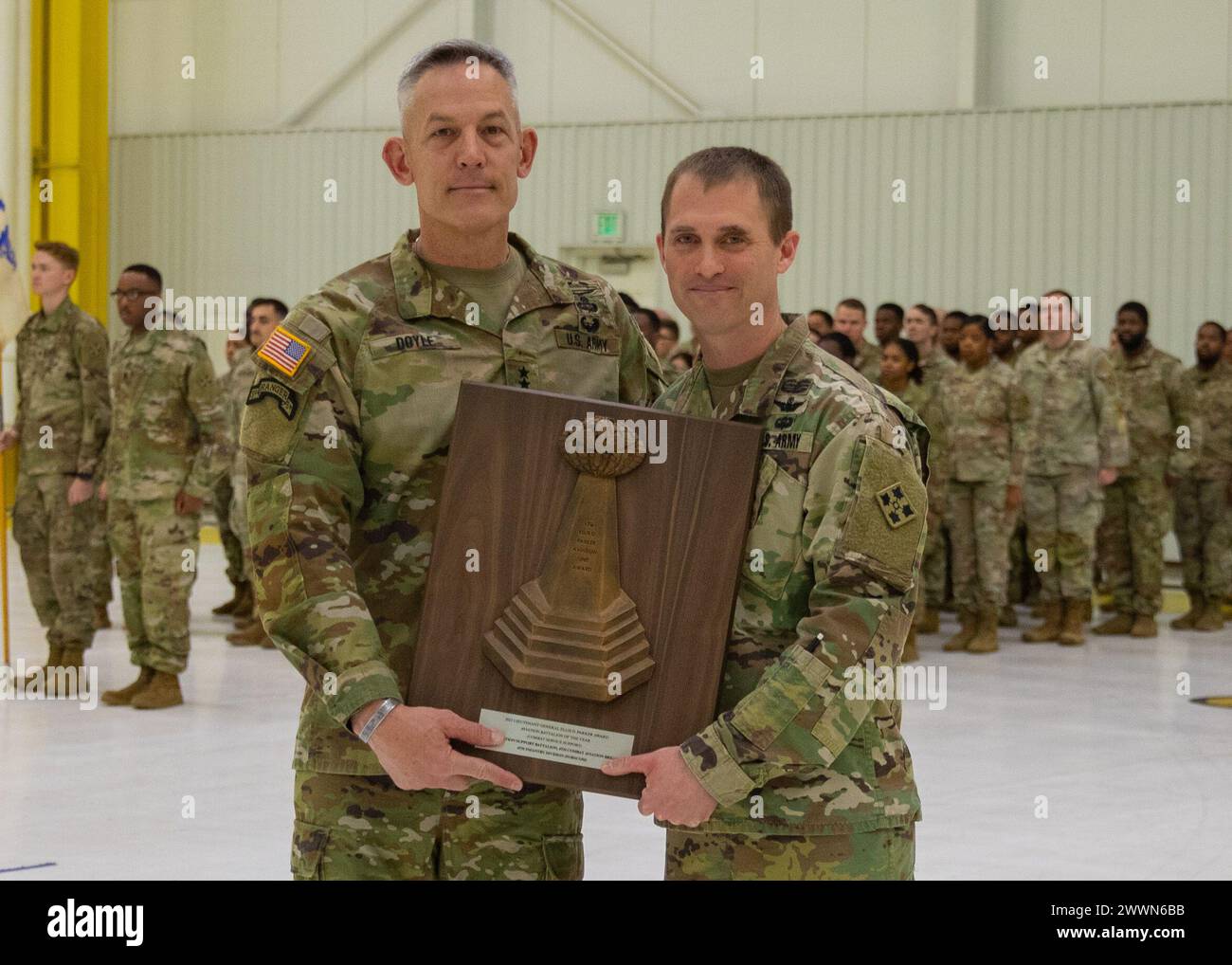 Maj. Gen. David Doyle, commanding general of the 4th Infantry Division, presents Lt. Col. Steven P. Sevigny, Battalion Commander of 404th Aviation Support Battalion, 4th Combat Aviation Brigade, 4th Infantry Division the 2024 Lt. Gen. Ellis D. Parker Award for best combat Service Support in the Department of the U.S. Army at 404th ASB Hangar, Fort Carson, Colorado on Feb. 12th, 2024. The award recognized excellence and encouraged innovative use of existing management tools and resources.  Army Stock Photo