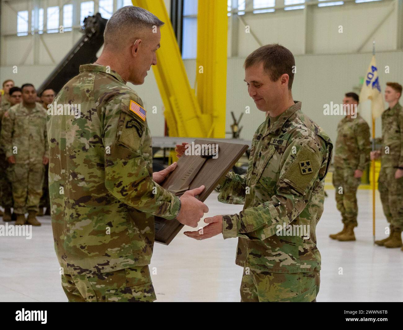 Maj. Gen. David Doyle, commanding general of the 4th Infantry Division presents Lt. Col. Steven P. Sevigny, Battalion Commander of 404th Aviation Support Battalion, 4th Combat Aviation Brigade, 4th Infantry Division, the 2024 Lt. Gen. Ellis D. Parker Award for best combat Service Support in the Department of the U.S. Army at 404th ASB Hangar, Fort Carson, Colorado on Feb. 12th, 2024. The Parker Award, a multi-component Department of the Army level award, recognized the battalion for the unit’s excellence in accomplishing its mission essential task list.  Army Stock Photo