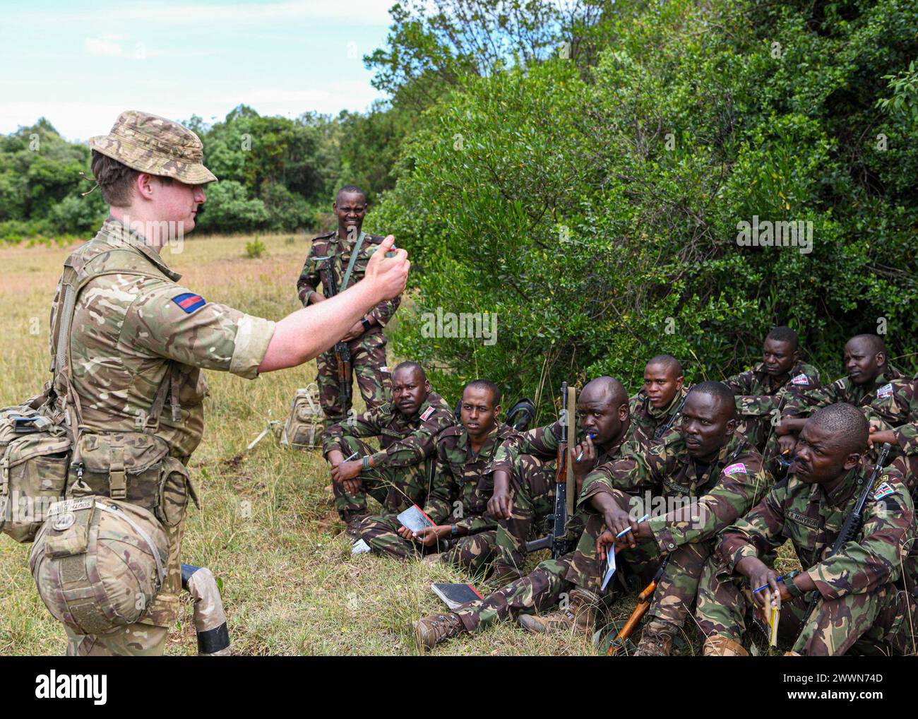 British army Drummer Thomas Sacker, assigned to 1st Battalion Irish Guards, 11th Security Force Assistance Brigade, educates the Kenya Defence Forces soldiers on how to control a victim operated improvised explosive device (IED) during counter-IED training at Justified Accord 2024 (JA24) held at the Counter Insurgency Terrorism and Stability Training Centre, Nanyuki, Kenya, February 26, 2024. Justified Accord 2024 is U.S. Africa Command's largest exercise in East Africa, running from February 26 - March 7. Led by U.S. Army Southern European Task Force, Africa (SETAF-AF), and hosted in Kenya, t Stock Photo