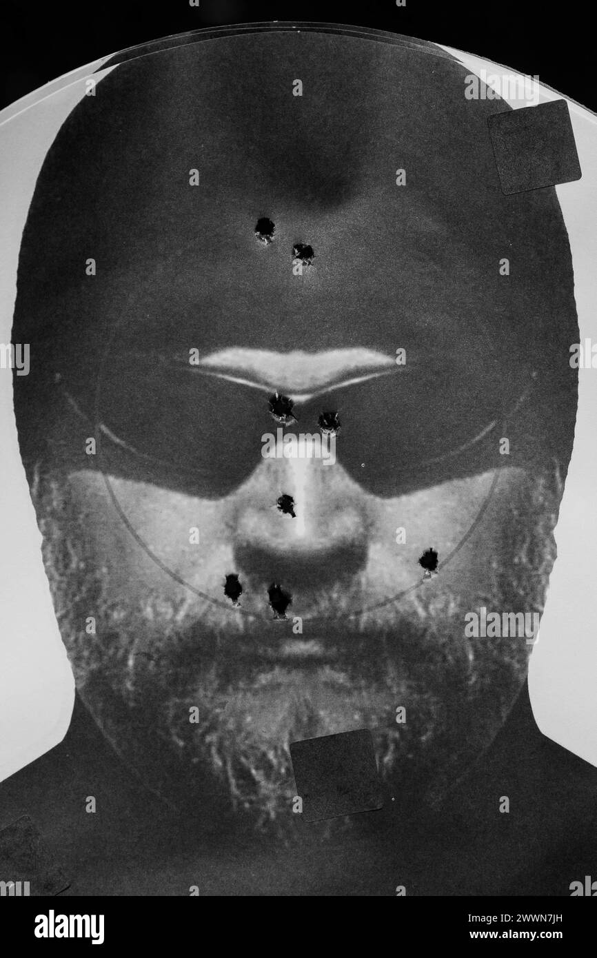 A target displays the results of shots fired by a U.S. Marine with ...