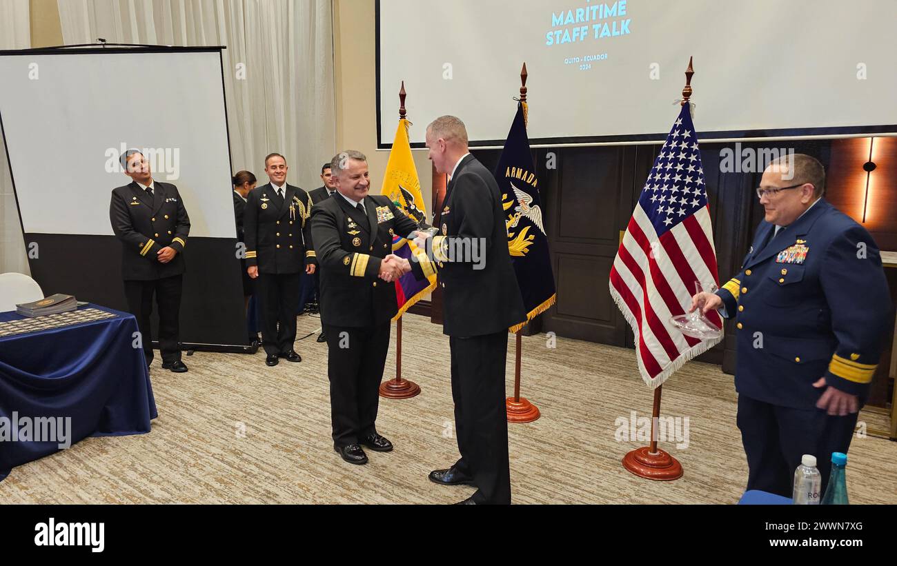 240227-N-N3764-1071 QUITO, Ecuador (Feb. 28, 2024) – Ecuadorian Navy Rear Adm. Pablo Caicedo, Ecuadorian Navy Chief of Staff, congratulates Navy Rear Adm. Jim Aiken, Commander U.S. Naval Forces Southern Command/U.S. 4th Fleet, during the closing ceremony of the U.S./Ecuador Maritime Staff Talks (MSTs) in Quito. Rear Adm. Andrew Sugimoto, right, Commander U.S. Coast Guard Eleventh District, and Rear Adm. Aiken led the U.S. delegation to the MST. U.S. Naval Forces Southern Command/U.S. 4th Fleet conducts an annual MST with the Ecuadorian Navy to discuss upcoming operations and exercises that wil Stock Photo