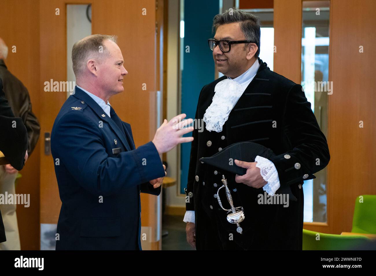 U.S. Air Force Col. D. Landon Phillips, left, 501st Combat Support Wing commander, speaks with Milan Shah, right, High Sheriff of Northamptonshire before a Ceremony of Remembrance at Stanwick Lakes, England, Feb. 22, 2024. U.S. and U.K. leaders gathered to honor 17 Airmen who died in a midair collision on Feb. 22, 1944, involving B-17 Flying Fortresses from the 303rd Bombardment Group at RAF Molesworth and the 384th Bombardment Group at RAF Grafton Underwood. The Airmen were part of Operation Argument, or 'The Big Week,' targeting enemy industrial sites and aircraft facilities in Central Europ Stock Photo